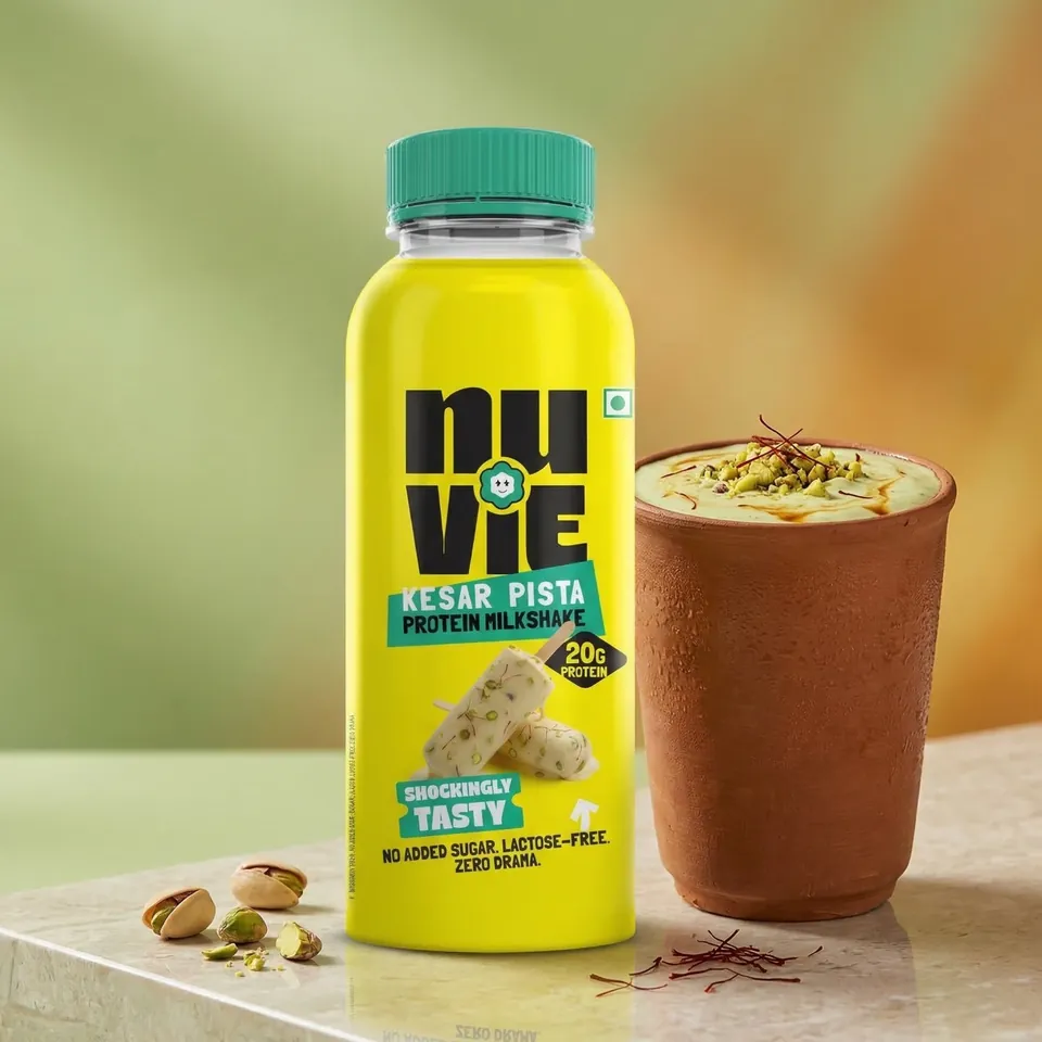 Kesar Pista shake bottle with a glass